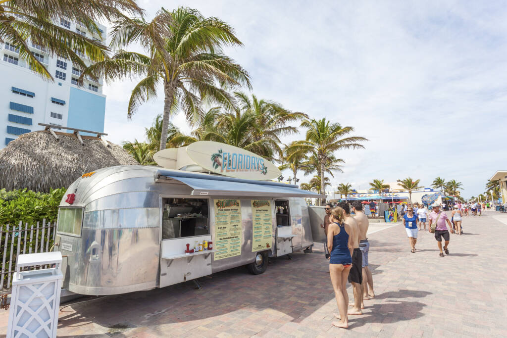 Hollywood Beach, Fl, USA - March 13, 2017: People at the Airstream food truck on Hollywood Beach broadwalk. Florida, United States