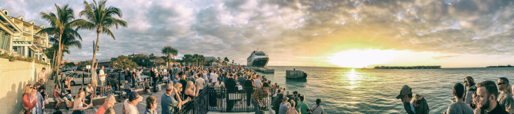 KEY WEST, FL - FEBRUARY 2016: Tourists awaits sunset in Mallory Square, panoramic view. Key West is a major tourist destination in Florida.