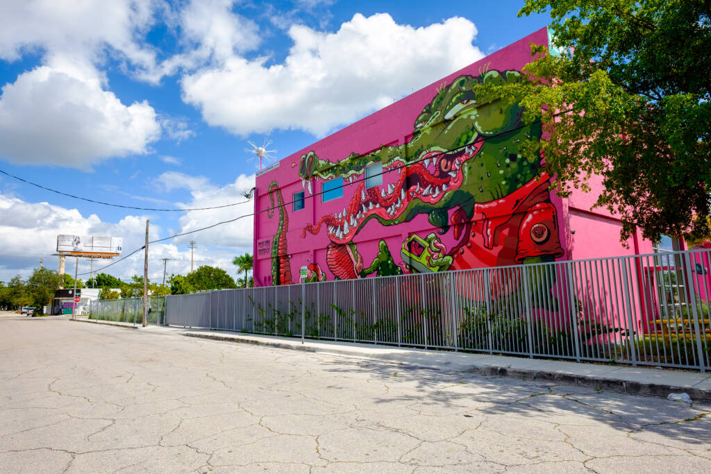 Miami, Florida USA - October 4, 2015: The  urban Wynwood area in midtown has become a popular tourist destination for the colorful graffiti art on the facades of commercial warehouse style buildings.